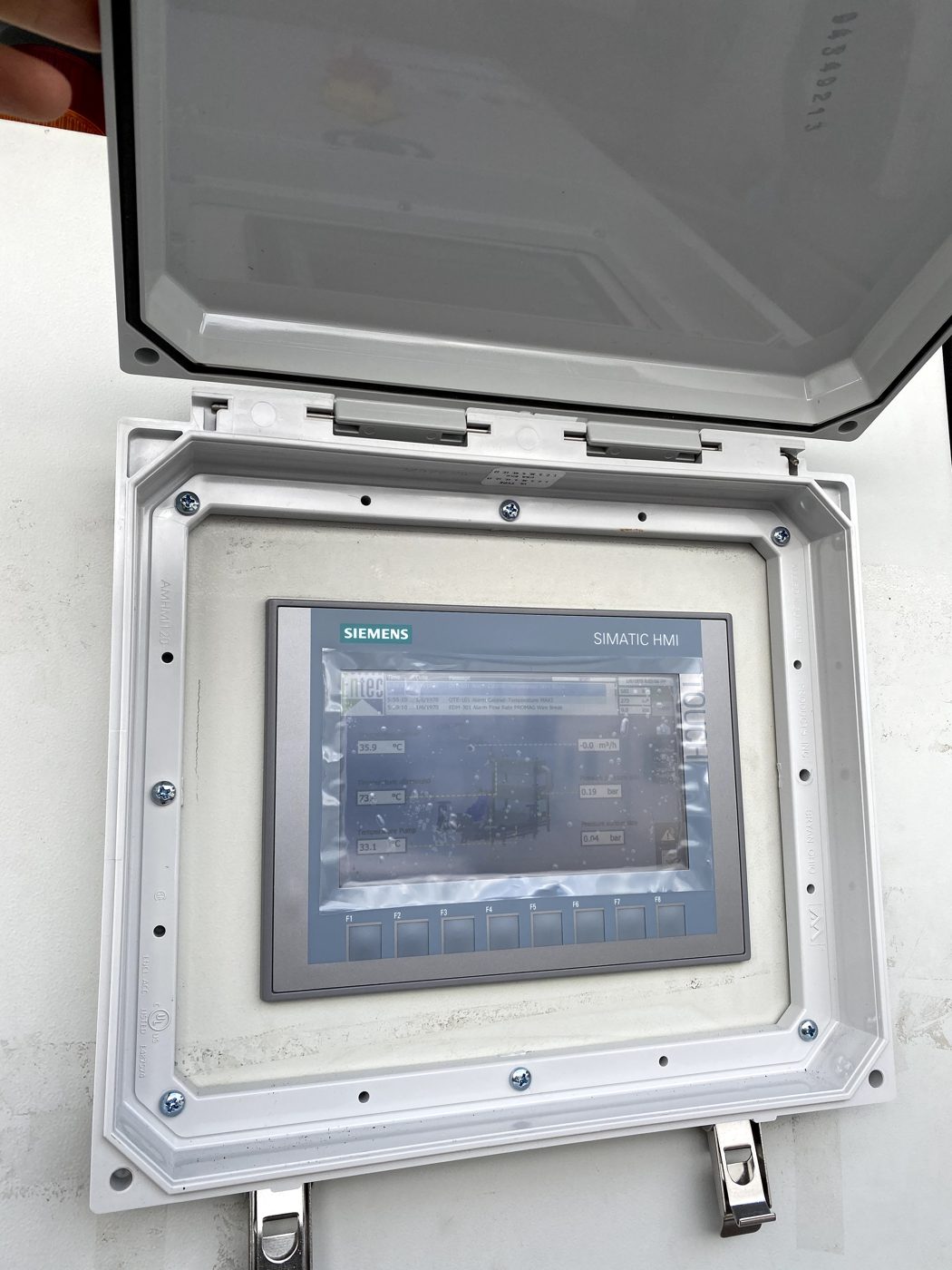 Basic Panel HMI installed with protective cover — customer site